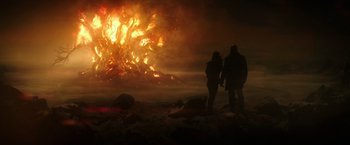 Movie still from “The Last Witch Hunter” (2015), directed by Breck Eisner – Two people are standing in front of a huge fire; Extreme Wide shot, Low angle