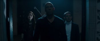 Movie still from “The Last Witch Hunter” (2015), directed by Breck Eisner – A group of people standing next to each other in a dark room; Medium shot, Low angle