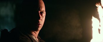 Movie still from “The Last Witch Hunter” (2015), directed by Breck Eisner – A man with bald head is looking at the camera; Close Up shot, Over the shoulder angle
