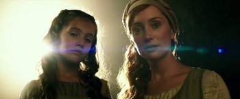 Movie still from “The Last Witch Hunter” (2015), directed by Breck Eisner – Two young women posing for a picture in the sunlight; Close Up shot, Low angle