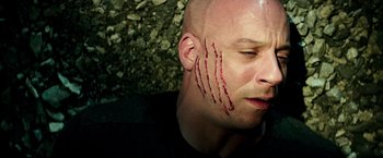 Movie still from “The Last Witch Hunter” (2015), directed by Breck Eisner – A bald man with blood on his face and neck; Close Up shot, Overhead angle