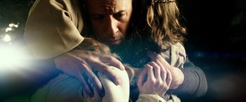 Movie still from “The Last Witch Hunter” (2015), directed by Breck Eisner – A man with long brown hair is hugging a woman; Close Up shot, Low angle