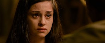 Movie still from “Rambo: Last Blood” (2019), directed by Adrian Grunberg – A person with a sad look on their face; Close Up shot, High angle