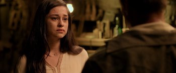 Movie still from “Rambo: Last Blood” (2019), directed by Adrian Grunberg – A young woman looking at a man in a bar; Close Up shot, Over the shoulder angle