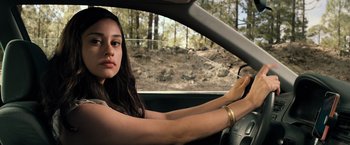 Movie still from “Rambo: Last Blood” (2019), directed by Adrian Grunberg – A woman sitting in the drivers seat of a car; Close Up shot, Over the shoulder angle
