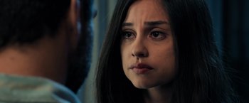 Movie still from “Rambo: Last Blood” (2019), directed by Adrian Grunberg – A person with long black hair; Close Up shot, Over the shoulder angle