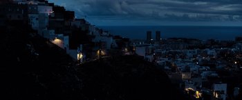 Movie still from “Rambo: Last Blood” (2019), directed by Adrian Grunberg – A view of a city at night from a hill at night; Extreme Wide shot, High angle