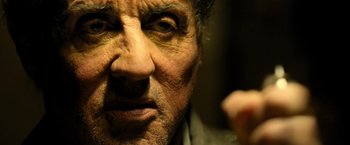 Movie still from “Rambo: Last Blood” (2019), directed by Adrian Grunberg – An old man with a beard and a mustache; Close Up shot, Low angle