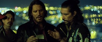 Movie still from “Rambo: Last Blood” (2019), directed by Adrian Grunberg – A couple of men standing next to each other; Close Up shot, Over the shoulder angle