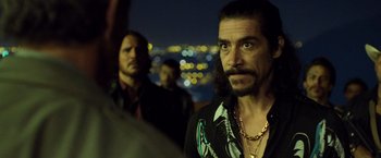 Movie still from “Rambo: Last Blood” (2019), directed by Adrian Grunberg – A man with long hair and a beard is looking at the camera; Medium shot, Over the shoulder angle