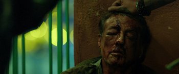 Movie still from “Rambo: Last Blood” (2019), directed by Adrian Grunberg – A man with blood all over his face and head; Close Up shot, Overhead angle