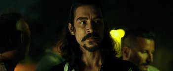 Movie still from “Rambo: Last Blood” (2019), directed by Adrian Grunberg – A person with long black hair; Close Up shot, Over the shoulder angle