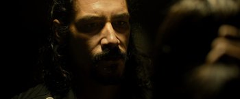 Movie still from “Rambo: Last Blood” (2019), directed by Adrian Grunberg – A person with a beard and mustache; Close Up shot, Over the shoulder angle