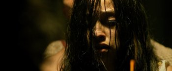 Movie still from “Rambo: Last Blood” (2019), directed by Adrian Grunberg – A person with long black hair; Close Up shot, Low angle