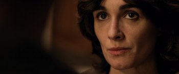 Movie still from “Rambo: Last Blood” (2019), directed by Adrian Grunberg – A woman's face in a dark room; Close Up shot, Over the shoulder angle