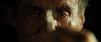 Movie still from “Rambo: Last Blood” (2019), directed by Adrian Grunberg – An older man's eyes are reflected in a mirror; Extreme Close Up shot, Low angle