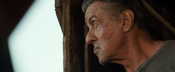Movie still from “Rambo: Last Blood” (2019), directed by Adrian Grunberg – An older man looking off into the distance; Close Up shot, Low angle