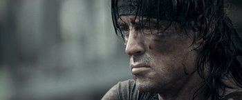 Movie still from “Rambo: Last Blood” (2019), directed by Adrian Grunberg – A person with wet hair; Close Up shot, Low angle