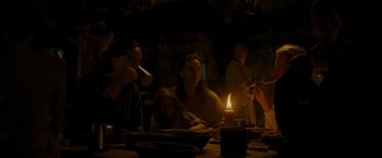 Movie still from “The Last of the Mohicans” (1992), directed by Michael Mann – A group of people sitting around a dinner table; Medium shot, Over the shoulder angle