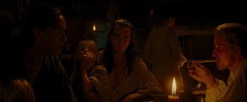 Movie still from “The Last of the Mohicans” (1992), directed by Michael Mann – A man and a child sitting next to each other; Medium shot, Over the shoulder angle