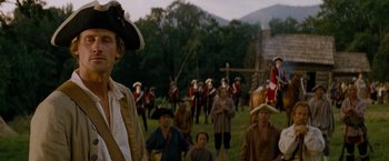 Movie still from “The Last of the Mohicans” (1992), directed by Michael Mann – A group of people dressed in period costumes; Medium shot, Over the shoulder angle