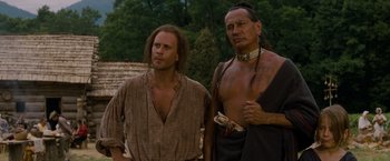 Movie still from “The Last of the Mohicans” (1992), directed by Michael Mann – Two native americans standing next to each other; Medium shot, Over the shoulder angle