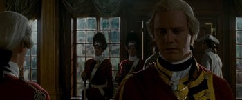 Movie still from “The Last of the Mohicans” (1992), directed by Michael Mann – A group of men standing next to each other in uniforms; Close Up shot, Over the shoulder angle