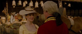 Movie still from “The Last of the Mohicans” (1992), directed by Michael Mann – A man and a woman wearing hats and clothing; Close Up shot, Over the shoulder angle