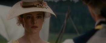 Movie still from “The Last of the Mohicans” (1992), directed by Michael Mann – A person wearing a hat; Close Up shot, Over the shoulder angle