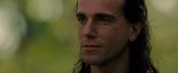 Movie still from “The Last of the Mohicans” (1992), directed by Michael Mann – A person with long hair; Close Up shot, Over the shoulder angle
