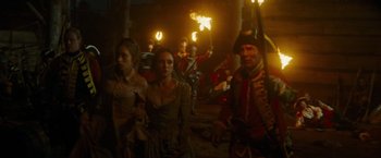 Movie still from “The Last of the Mohicans” (1992), directed by Michael Mann – A group of people in medieval garb holding torches; Wide shot, Low angle