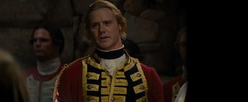 Movie still from “The Last of the Mohicans” (1992), directed by Michael Mann – A person wearing a uniform; Close Up shot, Over the shoulder angle