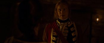 Movie still from “The Last of the Mohicans” (1992), directed by Michael Mann – A man dressed as a soldier in a uniform; Medium shot, Over the shoulder angle