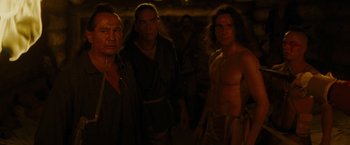 Movie still from “The Last of the Mohicans” (1992), directed by Michael Mann – A group of men standing next to each other; Medium shot, Over the shoulder angle
