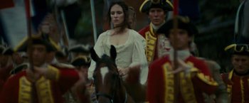 Movie still from “The Last of the Mohicans” (1992), directed by Michael Mann – A man and a woman are riding on a horse; Medium shot, Low angle