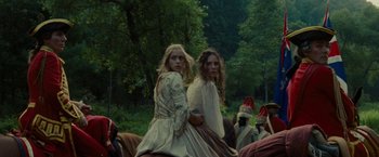 Movie still from “The Last of the Mohicans” (1992), directed by Michael Mann – Two women in medieval garb riding horses in a wooded area; Medium shot, Low angle