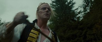 Movie still from “The Last of the Mohicans” (1992), directed by Michael Mann – A person with long blonde hair; Close Up shot, Low angle