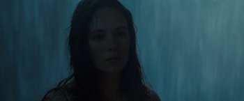 Movie still from “The Last of the Mohicans” (1992), directed by Michael Mann – A woman with long hair is standing in the dark; Close Up shot, Low angle