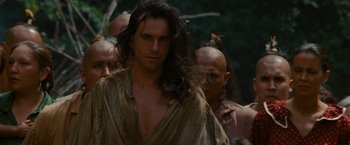 Movie still from “The Last of the Mohicans” (1992), directed by Michael Mann – A person with long brown hair; Close Up shot, Low angle
