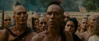 Movie still from “The Last of the Mohicans” (1992), directed by Michael Mann – A group of people standing next to each other; Close Up shot, Over the shoulder angle