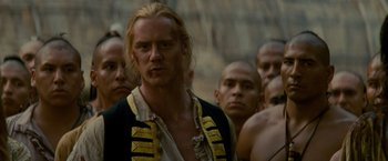 Movie still from “The Last of the Mohicans” (1992), directed by Michael Mann – A group of men standing next to each other; Close Up shot, Over the shoulder angle