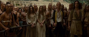 Movie still from “The Last of the Mohicans” (1992), directed by Michael Mann – A group of people standing next to each other; Medium shot, Low angle