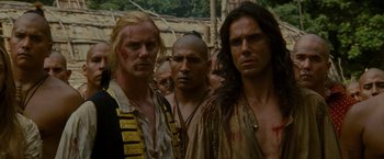 Movie still from “The Last of the Mohicans” (1992), directed by Michael Mann – A group of men standing next to each other; Close Up shot, Over the shoulder angle