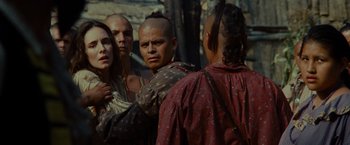 Movie still from “The Last of the Mohicans” (1992), directed by Michael Mann – A group of people standing next to each other on a field; Close Up shot, Over the shoulder angle