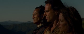 Movie still from “The Last of the Mohicans” (1992), directed by Michael Mann – Two men standing next to each other on top of a hill; Close Up shot, Over the shoulder angle