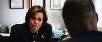 Movie still from “Rampart” (2011), directed by Oren Moverman – Close Up shot, Over the shoulder angle