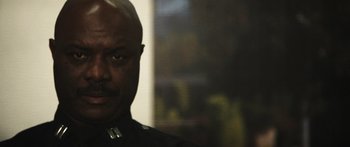 Movie still from “Rampart” (2011), directed by Oren Moverman – Close Up shot, Low angle