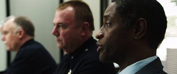 Movie still from “Rampart” (2011), directed by Oren Moverman – Close Up shot, Over the shoulder angle