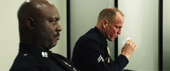 Movie still from “Rampart” (2011), directed by Oren Moverman – Close Up shot, Over the shoulder angle