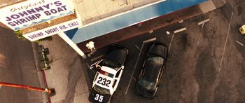 Movie still from “Rampart” (2011), directed by Oren Moverman – Extreme Wide shot, Overhead angle